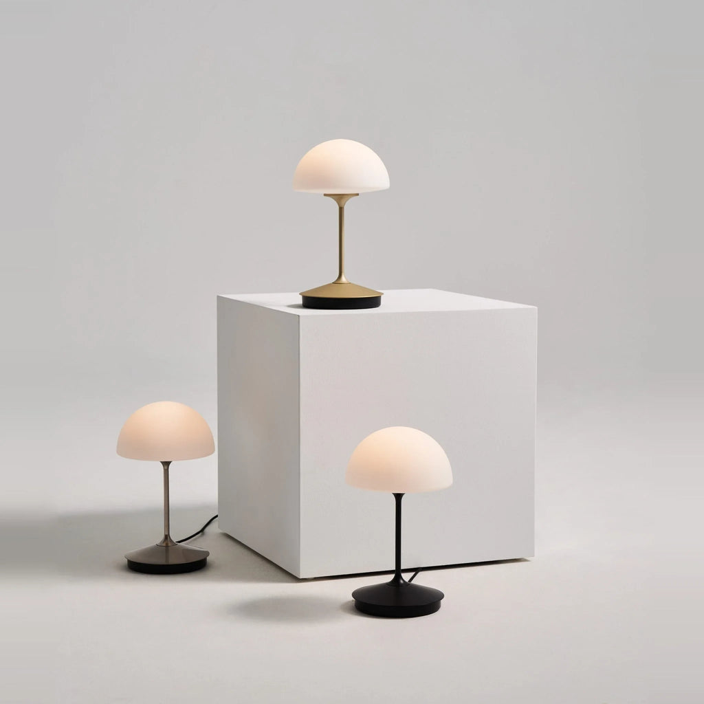 Opal glass dome table lamp with dimmer, three lamps on a white plinth