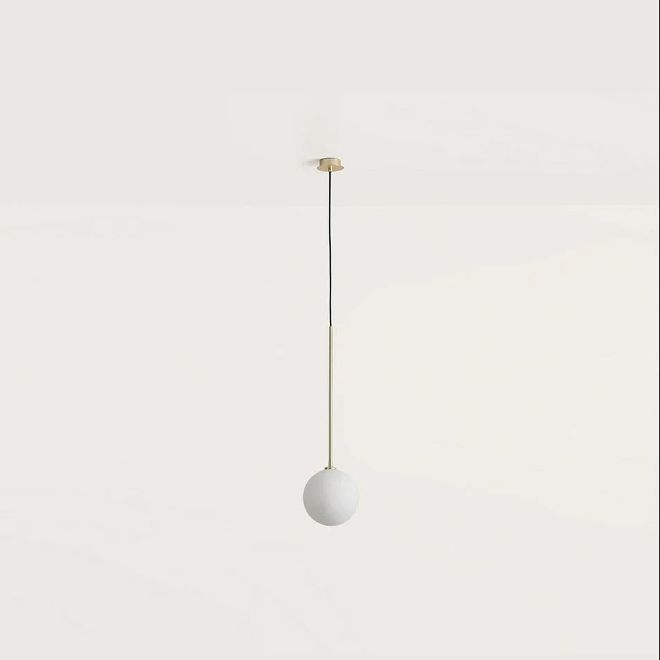 Opal glass globe pendant, with brass stem on a plain background
