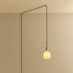 Opal rounded bulb plug-in pendant, routed across the ceiling and down the wall