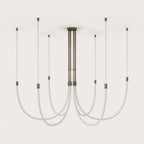 Opal silicone loop LED chandelier, unlit on a plain background