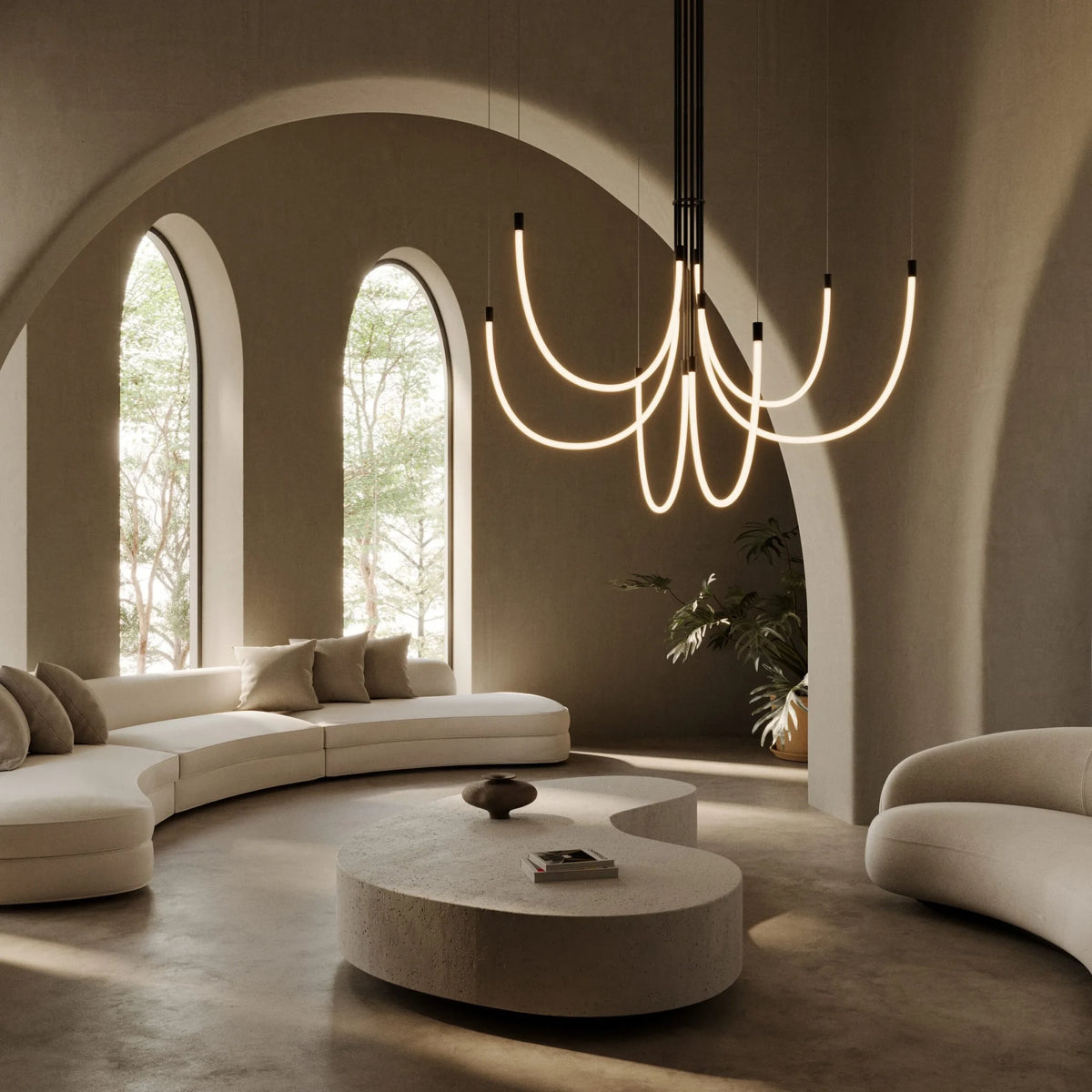 Opal silicone loop LED chandelier, lit in a living room with arched windows