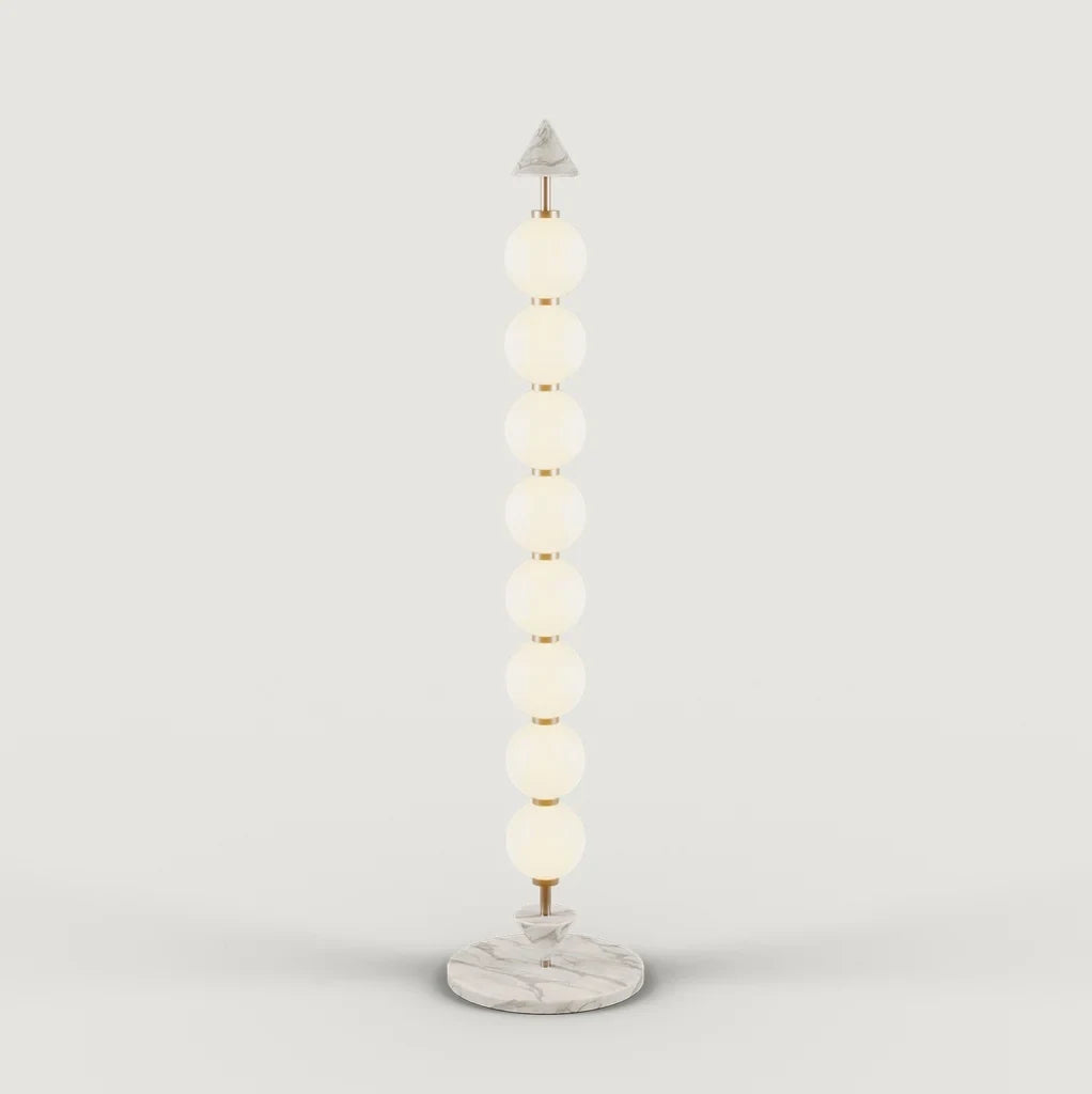 Eight-sphere opal glass floor lamp with a marble base, on a plain background