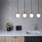 Opal Trapezoid Bulb Pendant, four hung in a row over a kitchen worktop