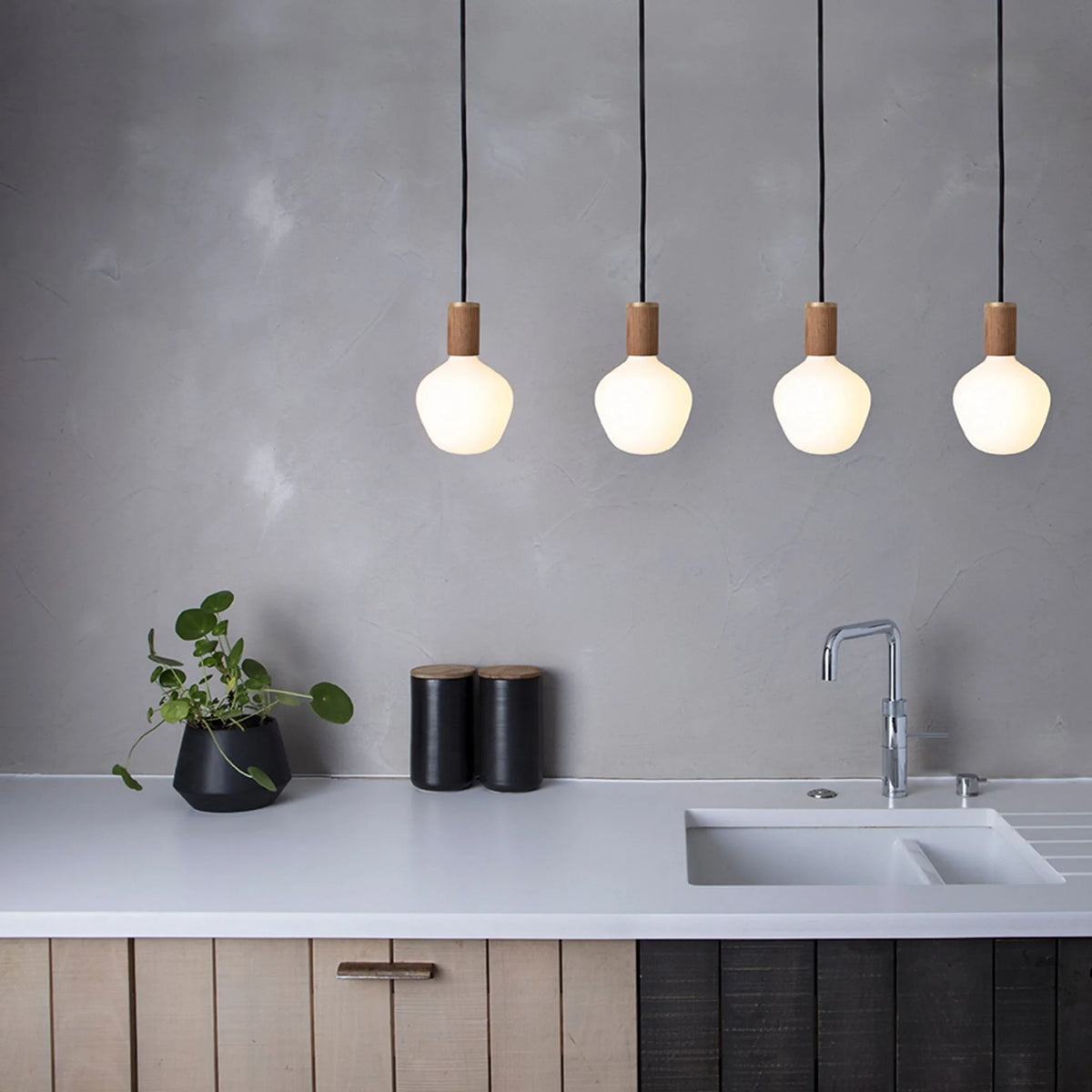 Opal Trapezoid Bulb Pendant, four hung in a row over a kitchen worktop