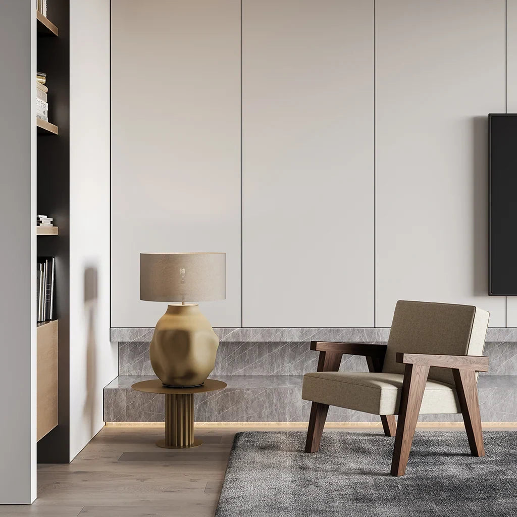 Organic ceramic base table lamp, in a living room, with a shade (not included)