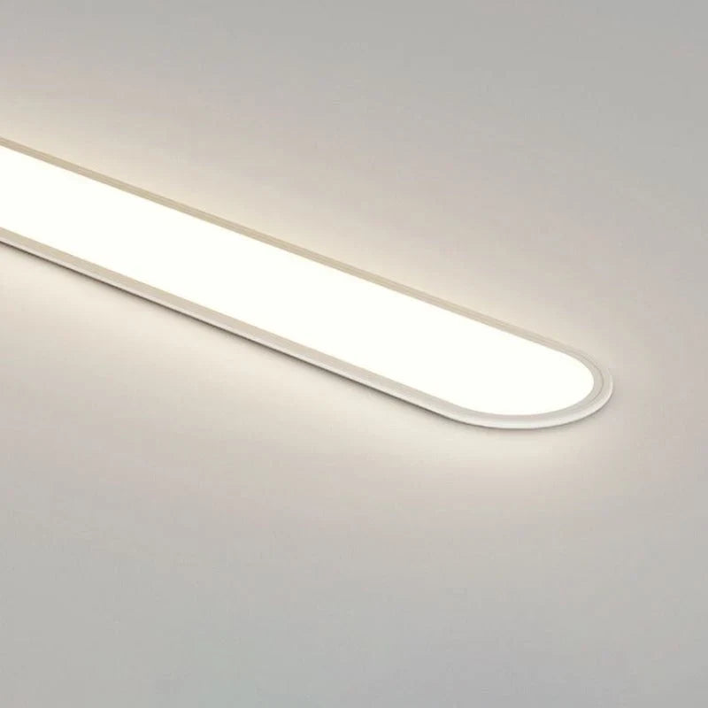 Slim oval LED ceiling light, lit, close-up