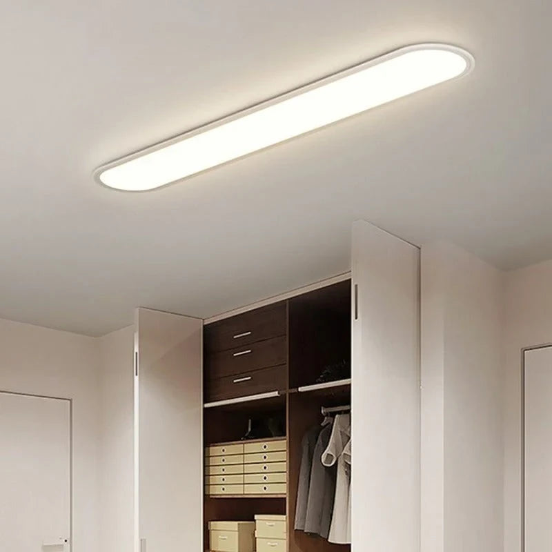 Slim oval LED ceiling light, in white in a dressing room