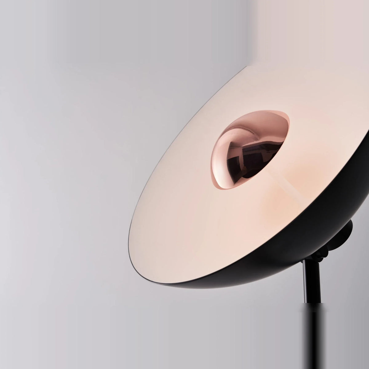 Oversize shade tripod floor lamp with black steel tripod, close-up of the shade