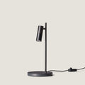 Pivoting spotlight table lamp with leather and ribbed metal head, in matte black