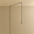 Plug-in brass pendant, cable routed across wall and ceiling