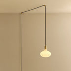 Plug-in pendant with opal oval bulb, brass, cable routed across wall and ceiling