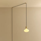 Plug-in pendant with small opal oval bulb, brass, cable routed across wall and ceiling