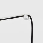 Plug-in pendant with small tinted sculptural bulb, stainless steel, cable node on the ceiling