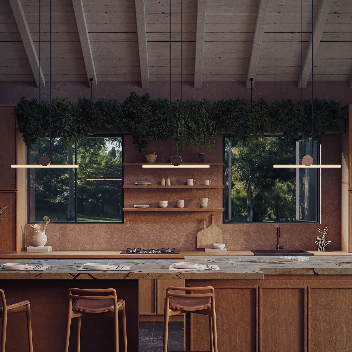 Polished brass linear LED pendant, a pair above a kitchen island