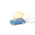 Table lamp with a glowing cloud on a small blue car, lit, side view