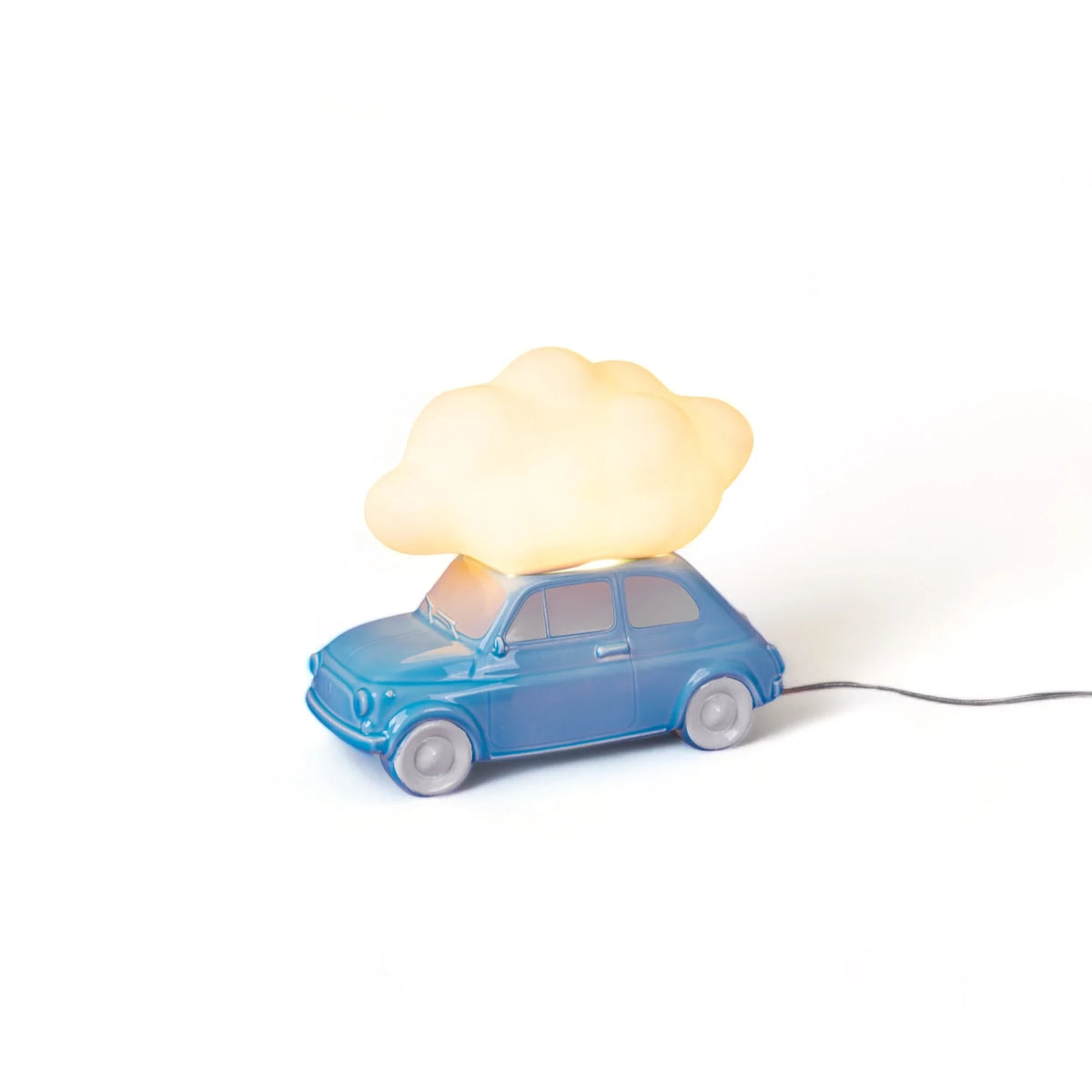 Table lamp with a glowing cloud on a small blue car, lit, side view