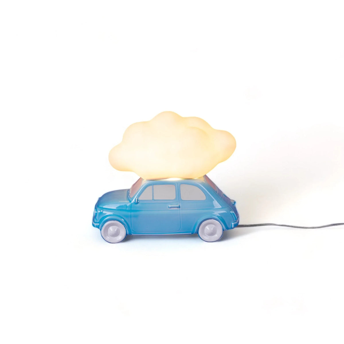 Table lamp with a glowing cloud on a small blue car, lit, side view