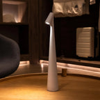 Slim cone cordless table lamp, lit in a living room