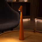 Slim cone cordless table lamp, lit in a living room
