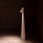 Slim cone cordless table lamp, lit in a living room