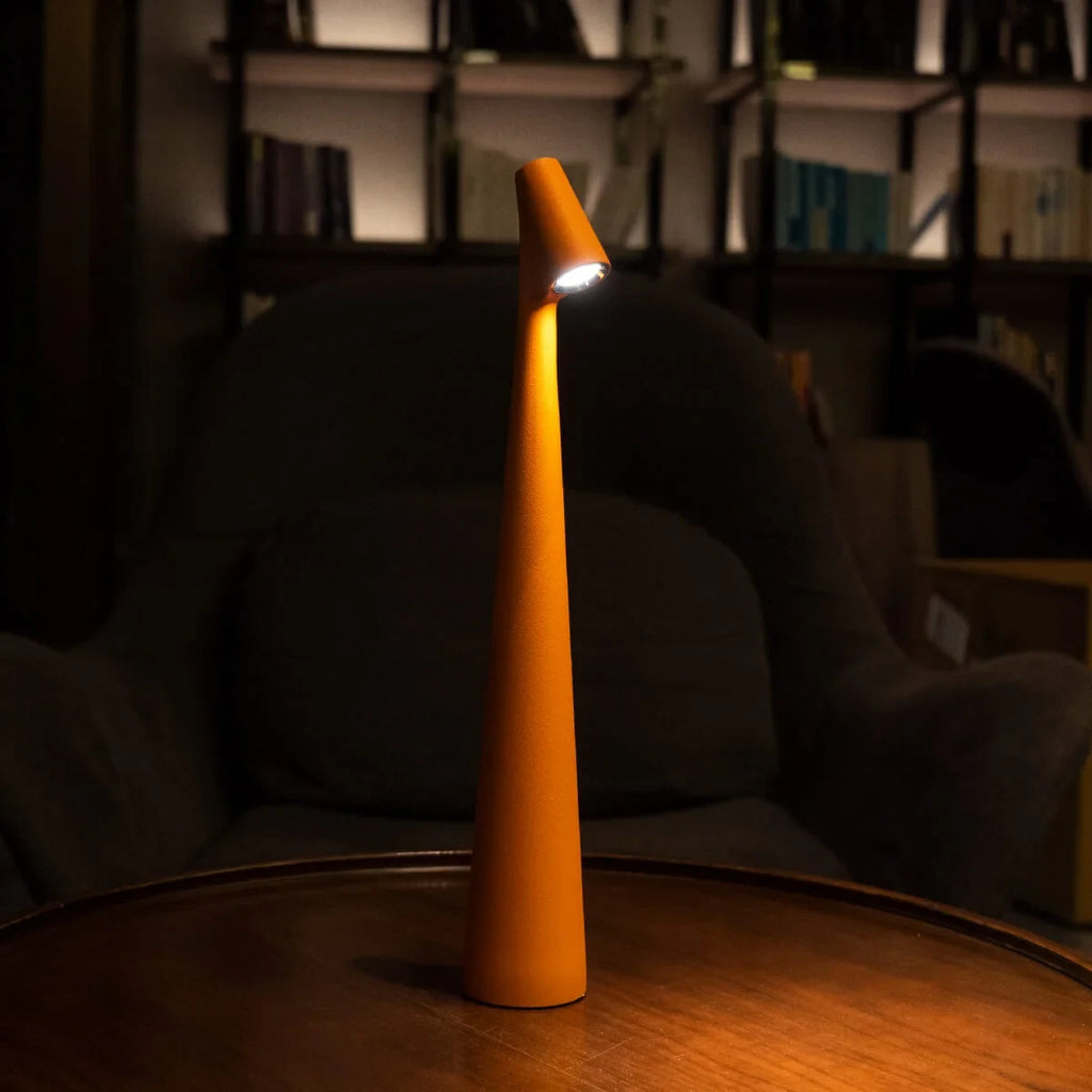 Slim cone cordless table lamp, lit in a living room