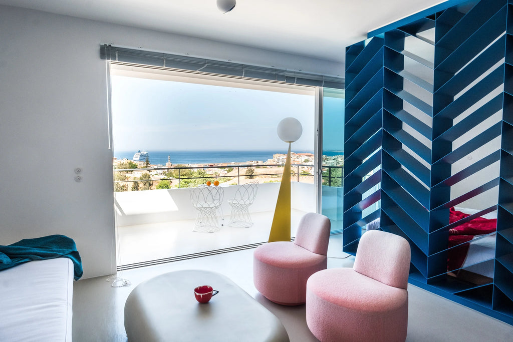 Pyramid base floor lamp with a white glass globe, in a seaside living room