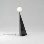 Pyramid base floor lamp with a white glass globe, in black