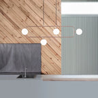 Rectangular Frame Four-Globe Linear Pendant, above a kitchen worktop