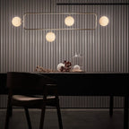 Rectangular Frame Four-Globe Linear Pendant, above a dining table