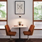 Rectangular frame LED pendant, portrait, above a small dining table