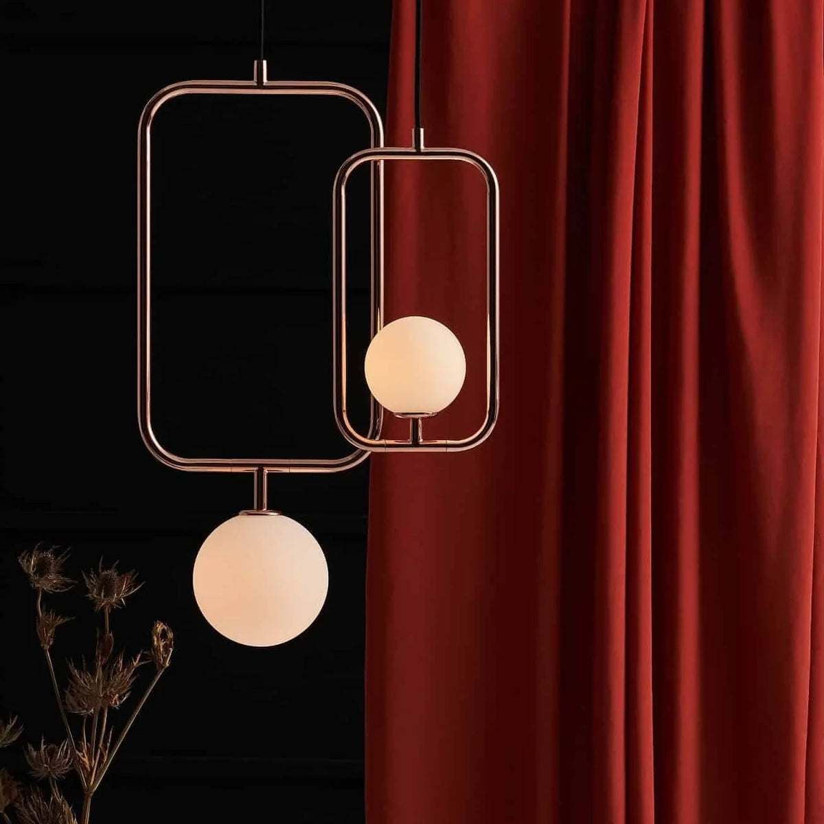 Rectangular Frame Opal Globe Pendant, two pendants against a red curtain