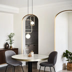 Rectangular Frame Opal Globe Pendant, above a round dining table