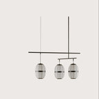 Ribbed cage three-light pendant, on a plain background