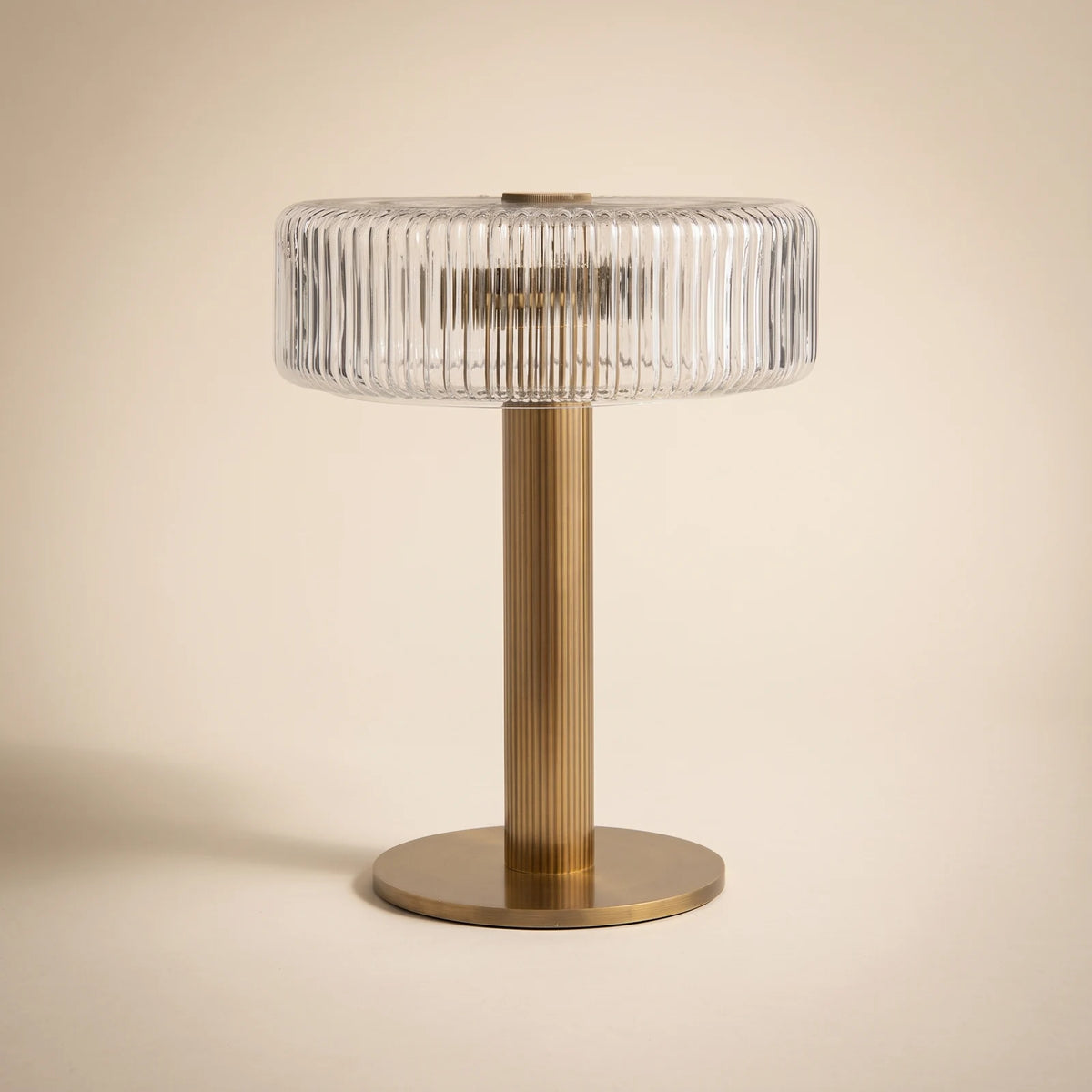 Ribbed glass table lamp with gold column base