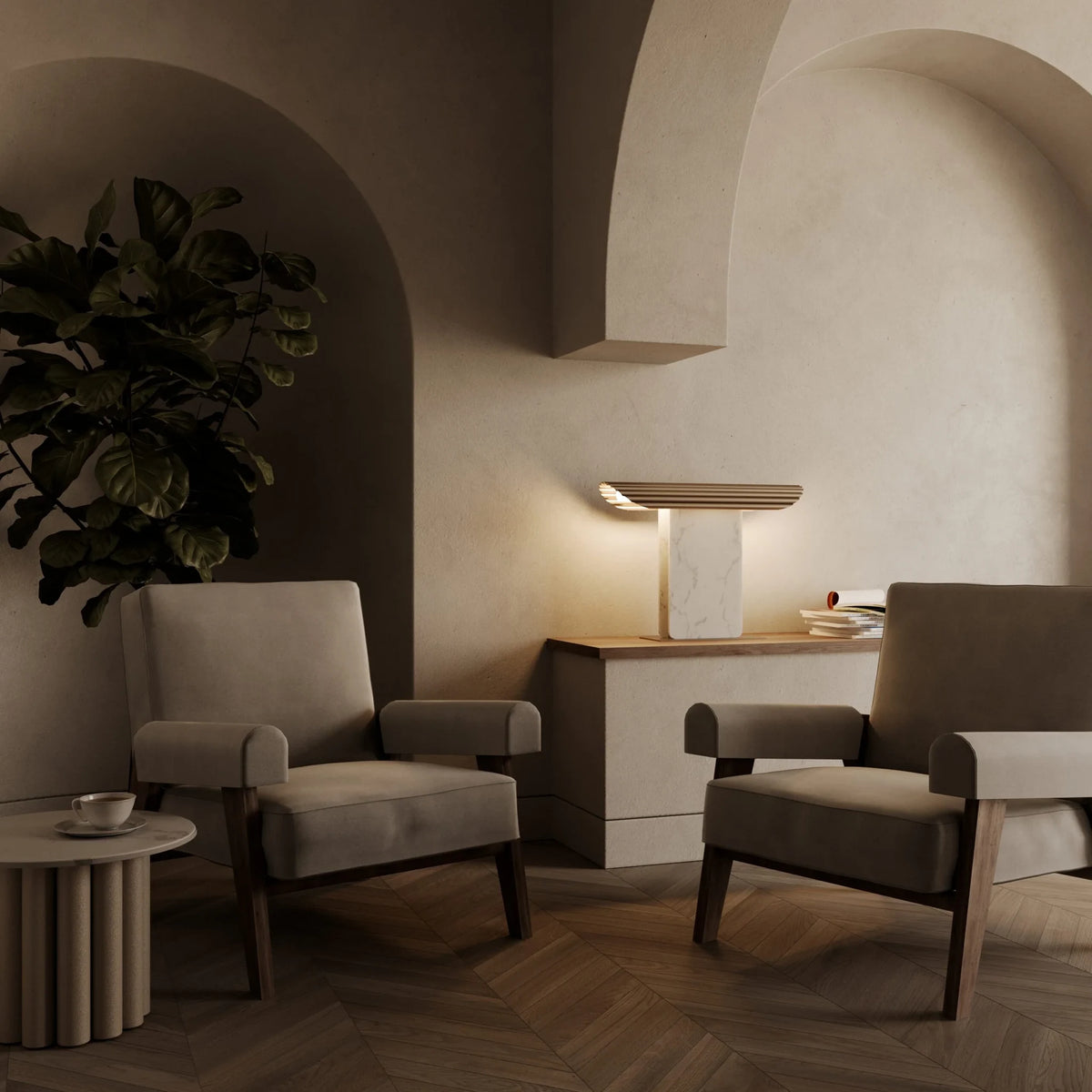 Ribbed head table lamp on marble column, lit, in a lounge with armchairs