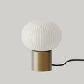 Ribbed opal glass globe table lamp, on an aged gold plinth