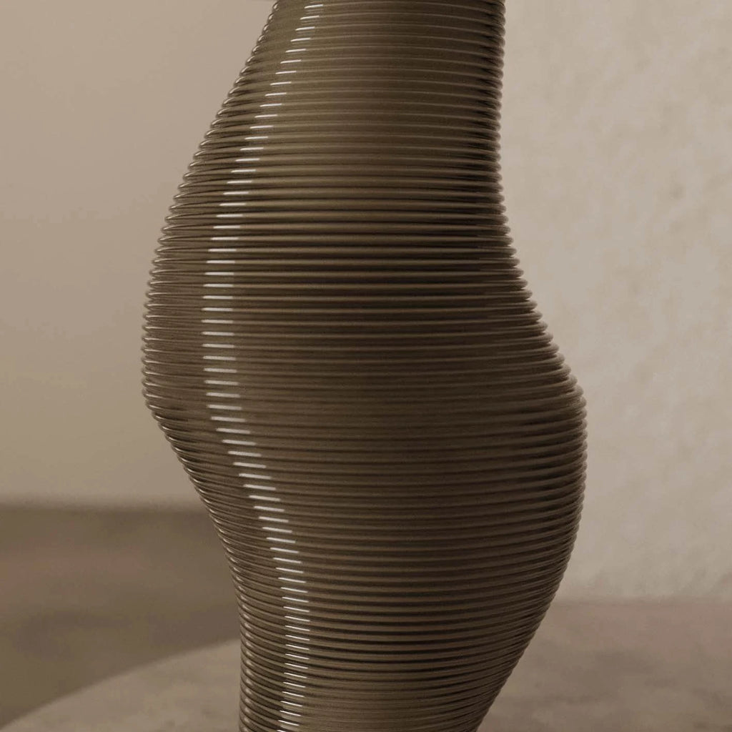 Ribbed sculptural glass table lamp, close-up of the ribbed glass
