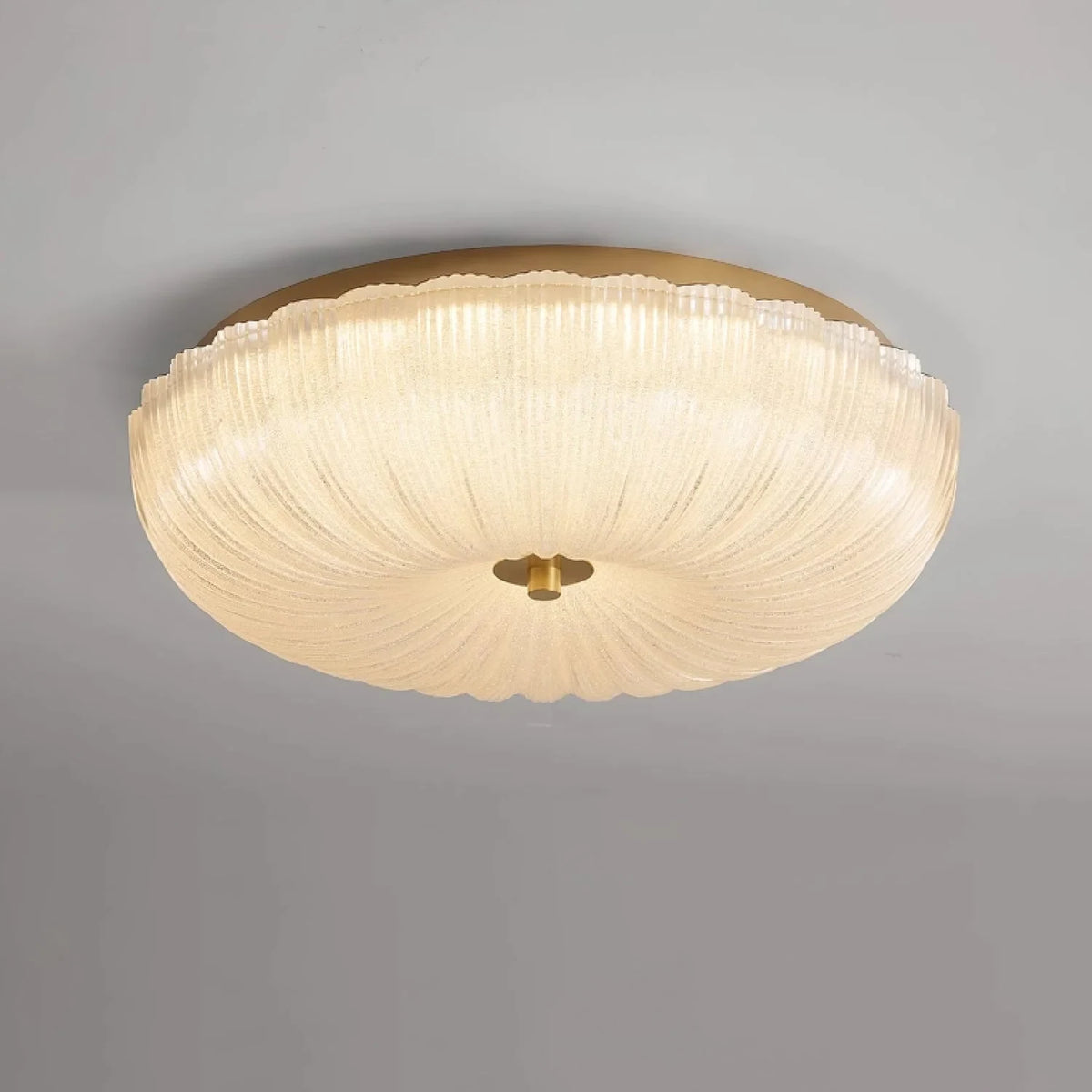 Ripple glass flush ceiling light, lit, close-up