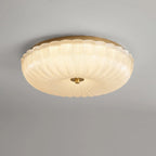 Ripple glass flush ceiling light, lit, close-up