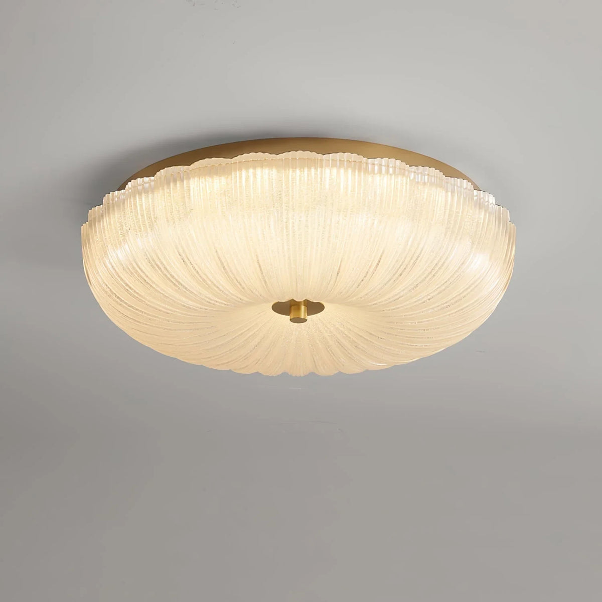Ripple glass flush ceiling light, lit, close-up