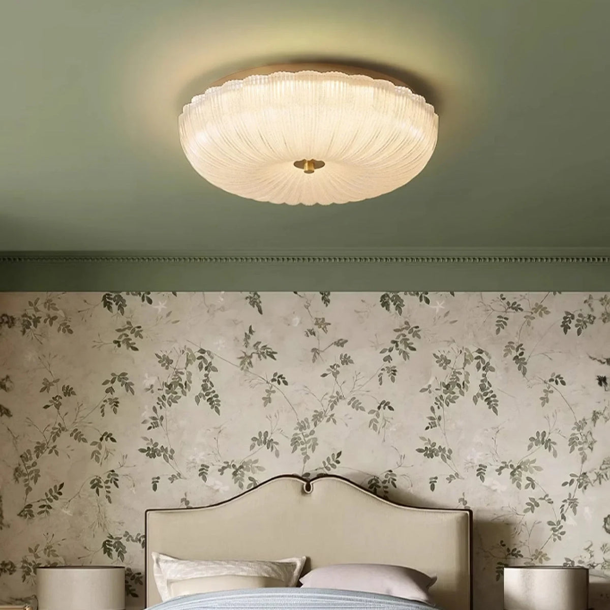 Ripple glass flush ceiling light, lit in a bedroom