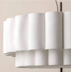 Layered ripple pendant light in white, close-up of the layers