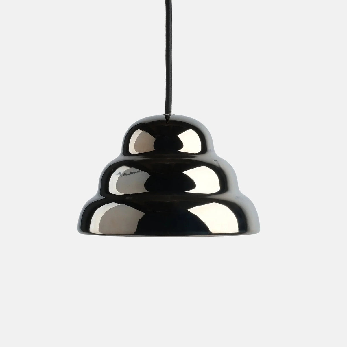 Rippled chrome-glaze stoneware pendant, on a plain background