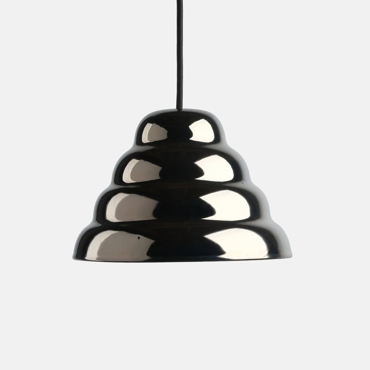 Rippled chrome-glaze stoneware pendant, on a plain background