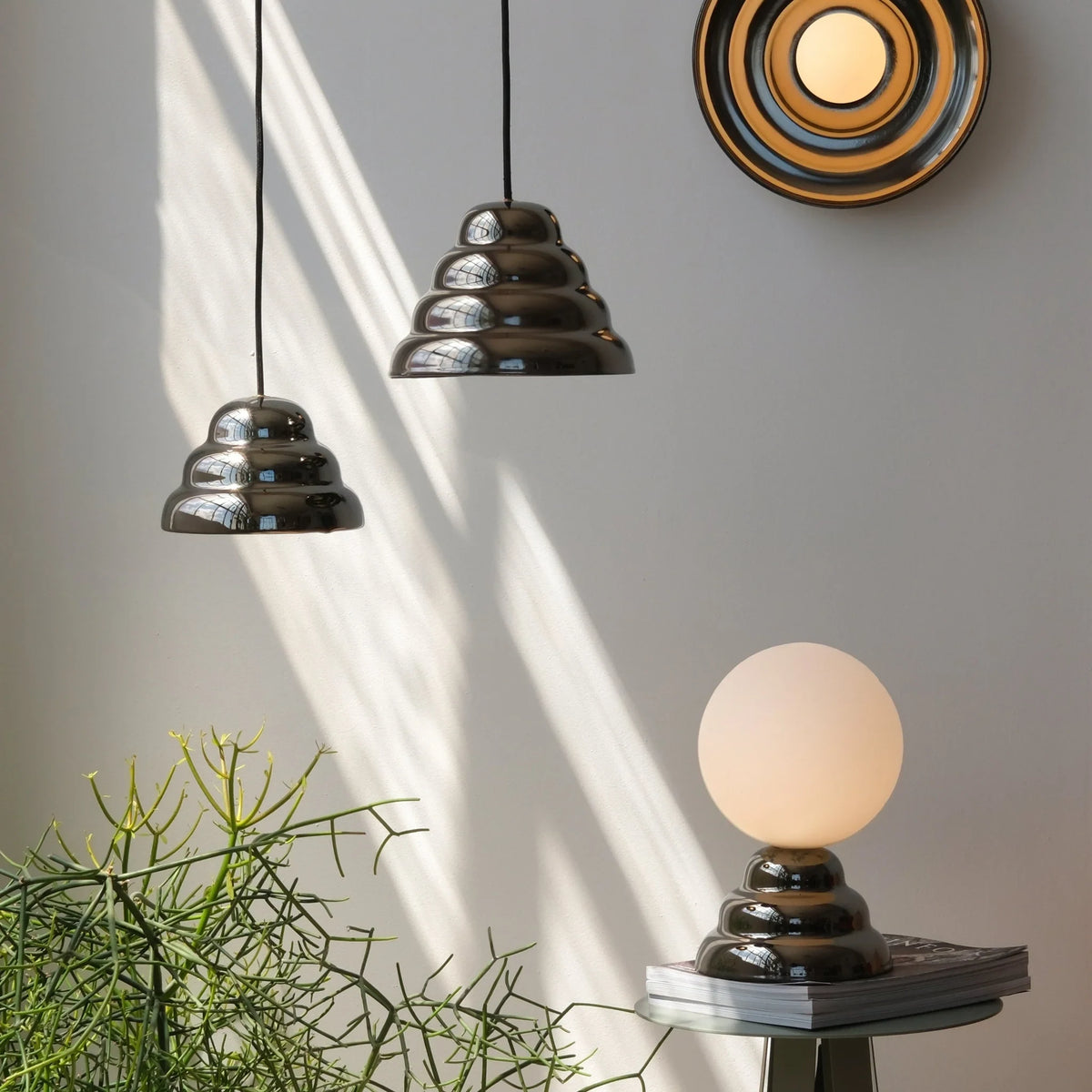 Rippled chrome-glaze stoneware pendant, shown with the smaller size