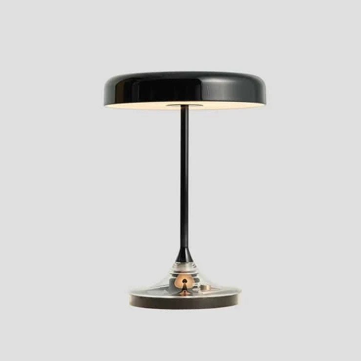 Black disc table lamp with rotating dimmer base, on a white background