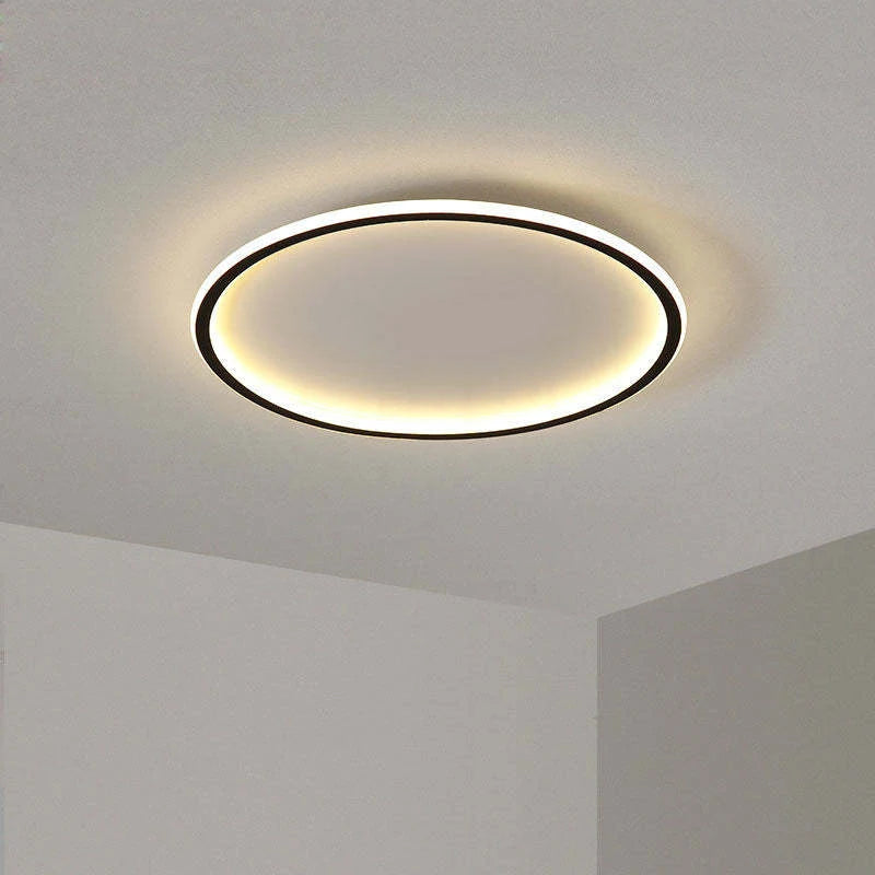 Round LED ring flush ceiling light, in black, lit