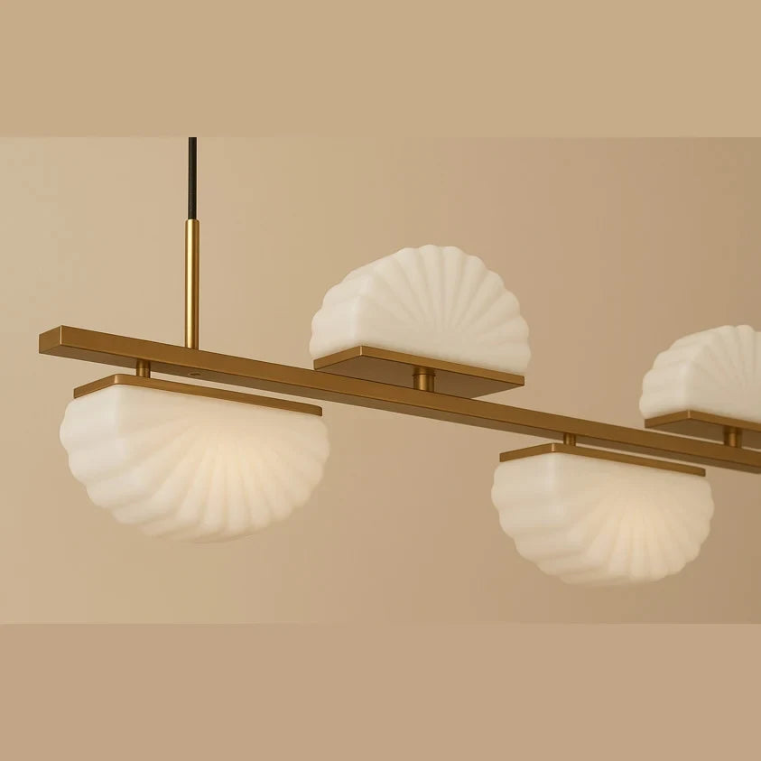 Scalloped opal glass linear pendant, close-up in aged gold