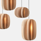 Sculptural white oak pendant, shown with other sizes