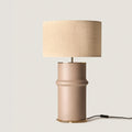 Segmented ceramic column table lamp, in taupe, with a linen shade (not included)